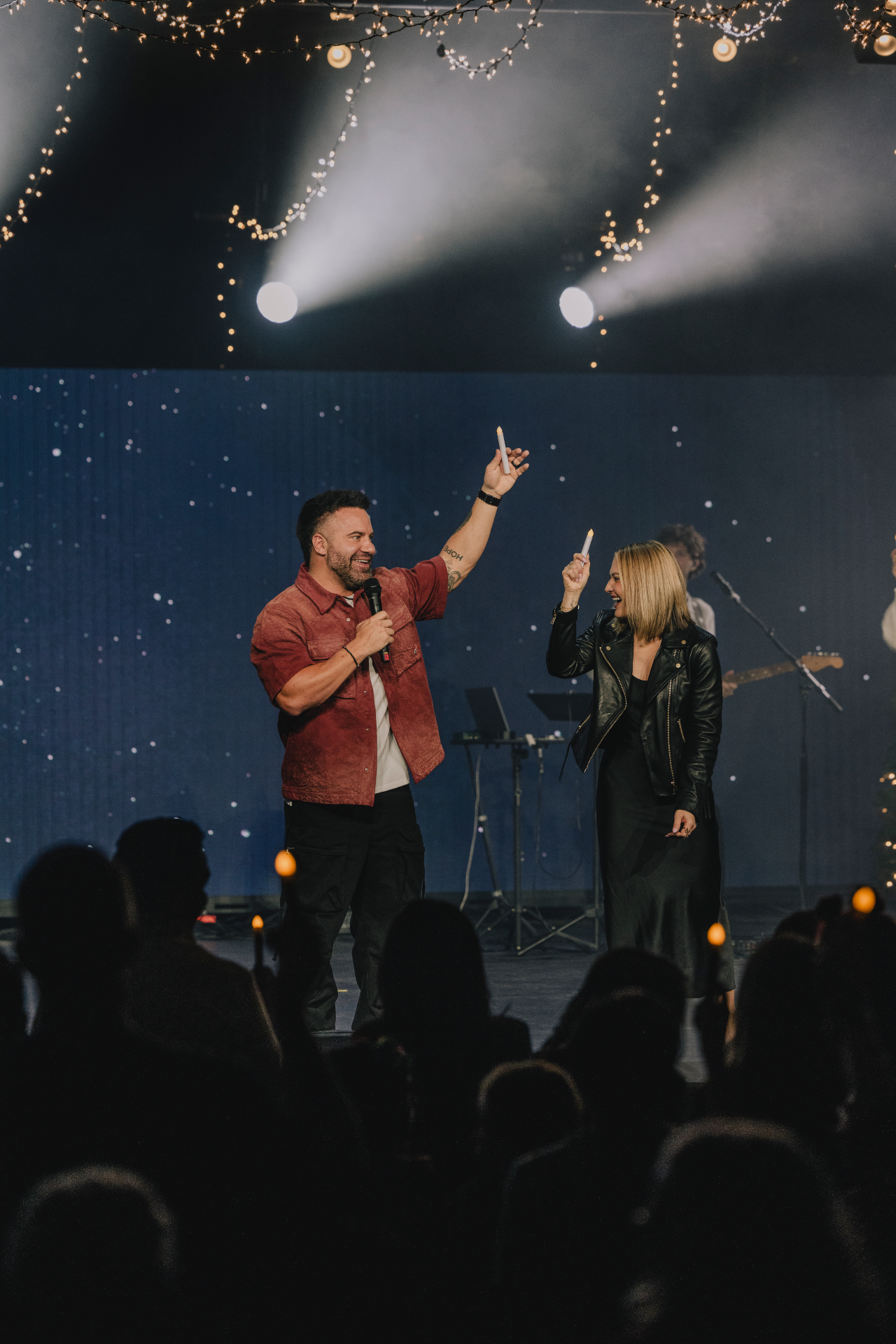 James and Brit Powell speaking together onstage
